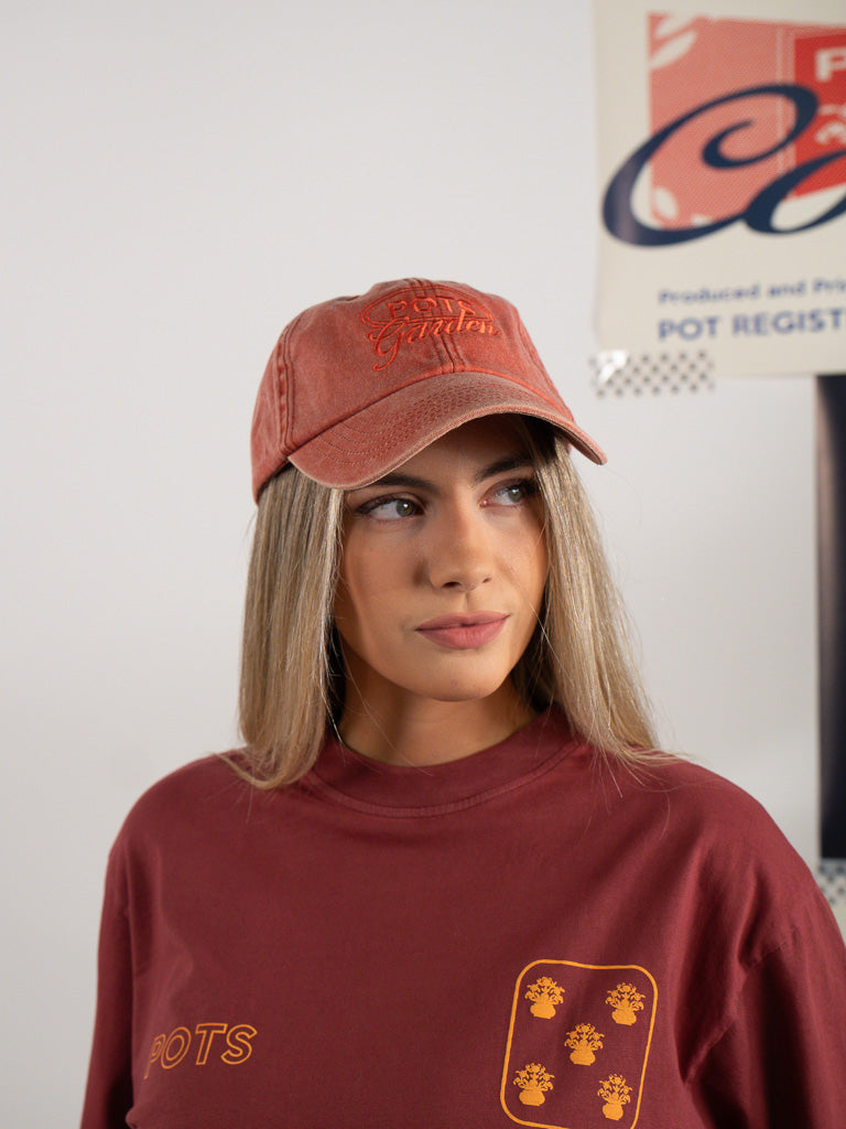 ORANGE WORN CAP
