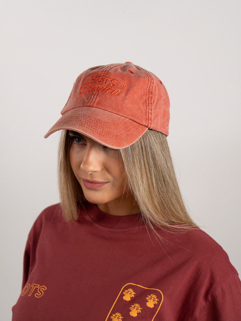 ORANGE WORN CAP
